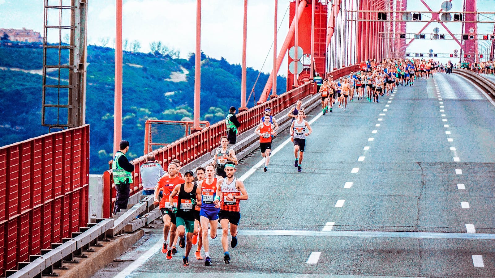 A group of marathon runners in an urban race, highlighting endurance and competition.